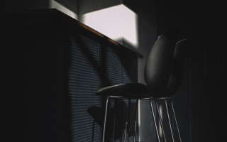 Dark room metal stool backlit - a window behind free wallpaper