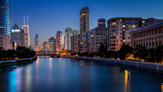 City river night bridge skyline - the background and a bridge in the foreground free wallpaper