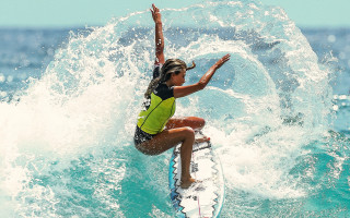 Woman surfing wave sunny ocean - top of a surfboard in the ocean free wallpaper