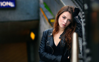 Woman blackjacket leaning wall bokeh - leaning free wallpaper