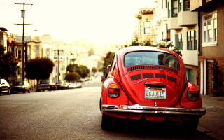 Red car road building street - car free wallpaper