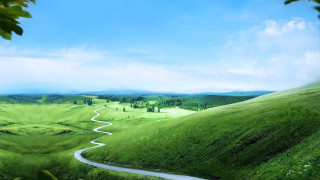 Winding road green valley blue - a lush green valley free wallpaper