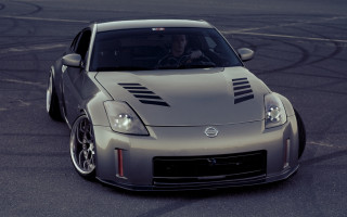 Silver sports car driver night - a track free wallpaper