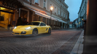 Yellow sports car cobblestone street - yellow free wallpaper