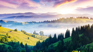 Mountain range foggy valley distant - a house in the distance free wallpaper