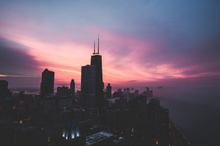 City skyline dusk purple pink - sky in the background free wallpaper