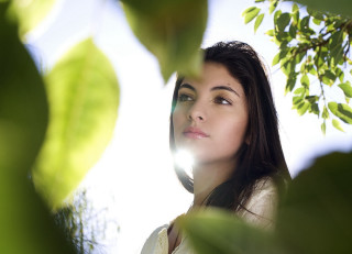 Woman sky leaves light bokeh - bright free wallpaper