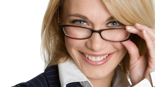 Woman smiling glasses blue eyes - her right hand free wallpaper