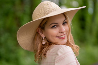 Woman smiling hat blonde outdoors - the background in the background free wallpaper