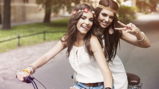 Two girls bike peace smile - the peace sign free wallpaper