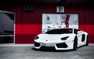 White sports car red building - a red building free wallpaper