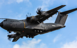 Military plane blue sky clouds - a large military plane free wallpaper