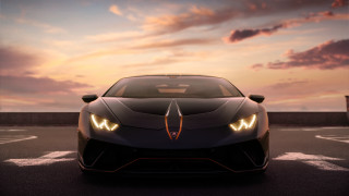 Black sports car sunset cloudy 3 - a parking lot free wallpaper