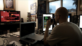 Man sitting desk laptop computer - doc hammer free wallpaper