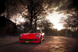 Red sports car cobblestone street 2 - a red sports car free wallpaper