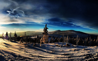 Snowy ski slope mountain clouds - a sky background and sun free wallpaper