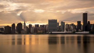City skyline water cloudy sky 8 - a cloudy sky in the background free wallpaper