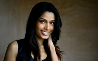 Woman smiling black hair portrait - her cheek free wallpaper