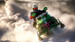 Snowmobile rider cloudy sky helmet - a sky background behind them free wallpaper