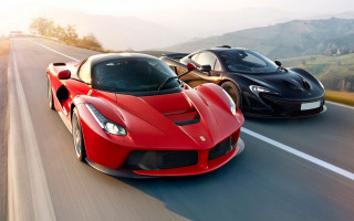Red black sports cars mountains - a blue sky free wallpaper