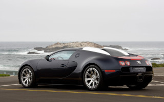 Black sports car ocean rock - a large body of water free wallpaper