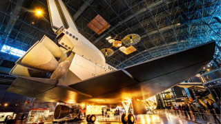 Space shuttle museum night cityscape - display in a museum free wallpaper