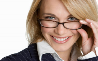 Woman glasses suit smiling adjusting - her right hand free wallpaper