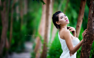 Woman white dress forest bokeh 2 - a tree in a forest free wallpaper