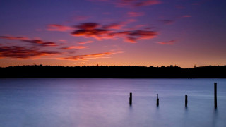 Sunset lake hill clouds orange - a few pole free wallpaper