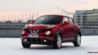 Red nissan juke snow building - photorealism free wallpaper