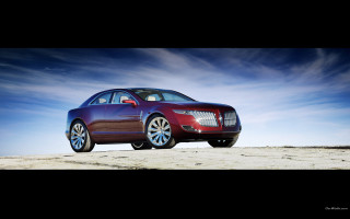 Red car beach blue sky - sandy free wallpaper