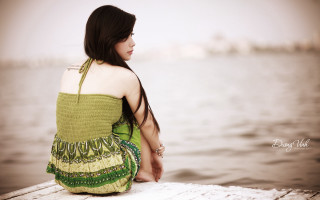 Woman dock water green dress - the water and buildings free wallpaper