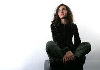 Woman sitting stool legs crossed - a stool free wallpaper