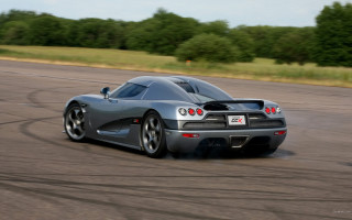 Silver sports car driving motion - excessivism free wallpaper
