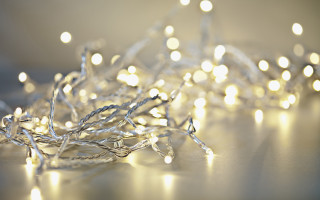 White lights table bokeh moon - a white wall behind them free wallpaper