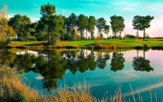 Golf pond trees clouds reflection - a pond and trees free wallpaper