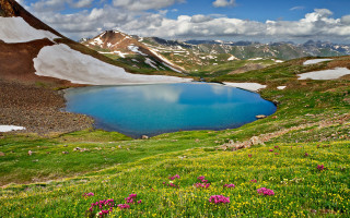 Blue lake mountains flowers sunny 2 - a blue lake free wallpaper