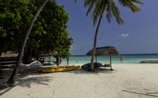 Beach umbrella kayaks people sky - panoramic view free wallpaper