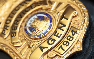 Police badge black jacket blue - action scene free wallpaper