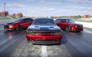 Three red black cars driving - a track free wallpaper