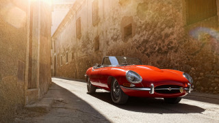 Red sports car stone building - the side of a road next free wallpaper