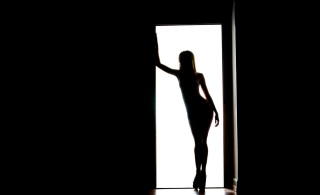 Woman doorway shadow silhouette backlighting - free light wallpaper