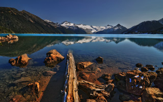 Lake mountains log sky water - in the middle of it free wallpaper