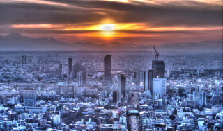 Cityscape sunset mountains cloudy sky - a sunset in the background and mountains free wallpaper