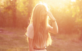Woman field hair blowing sunset - a photo free wallpaper