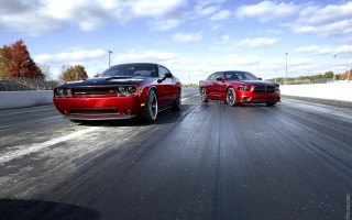 Red cars race track cloudy - blue sky free wallpaper
