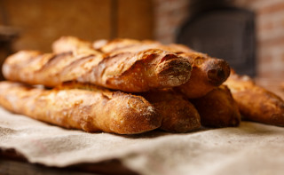Bread pile table brick wall - brassaï free wallpaper