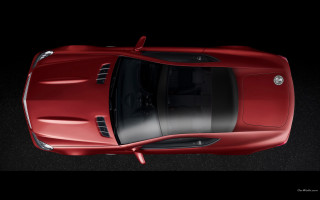 Red sports car above dark - feature free wallpaper