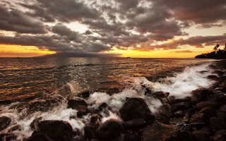 Sunset water lighthouse rocks stormy - free beach wallpaper