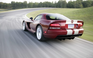 Red sports car driving road 28 - motion blur free wallpaper for desktop